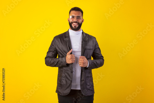 Man wearing glasses, black leather jacket, white shirt, with beard, with various facial expressions