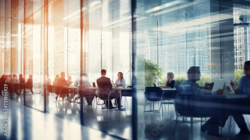 Business background: Blurred business people in innovative Business Meeting: Team at Work