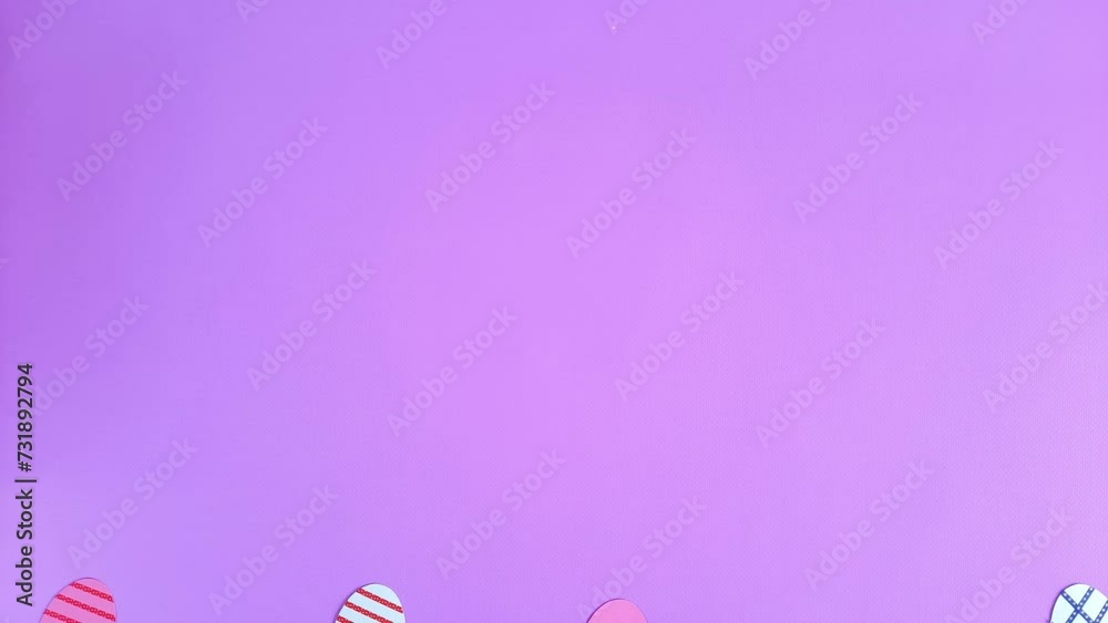 Happy Easter video card with place for text, greeting inscription, message, advertising. Colored decorative paper eggs with ornaments appear from below. Cheerful holiday template in handmade style