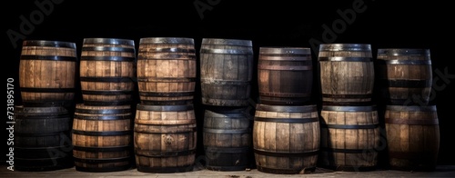 Old wooden whiskey, scotch, wine barrels stack in a warehouse. AI generated image
