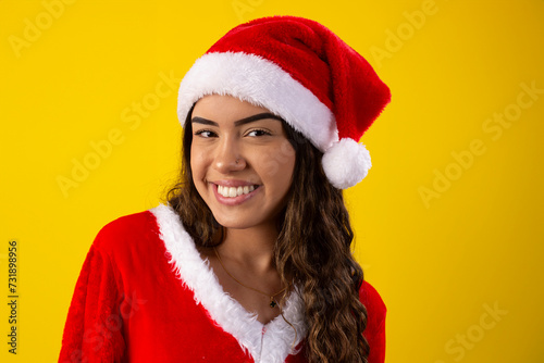 Happy young woman dressed as Santa Claus