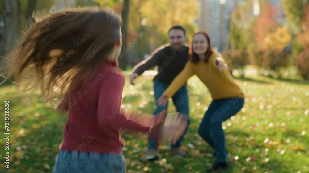 Happy family playing hugging in park sunny autumn mother father waiting little child kid daughter girl run to parents running hugging mommy dad hug cuddle embrace smiling play game love closeness Happy family playing hugging in park sunny autumn mother father waiting little child kid daughter girl run to parents running hugging mommy dad hug cuddle embrace smiling play game love closeness