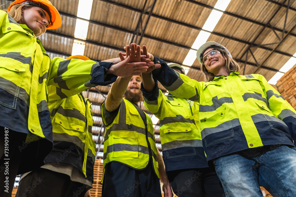 Group of warehouse people putting hands together Group of warehouse people putting hands together
