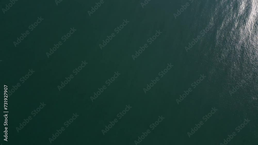 Serene Aerial View of The Calm Ocean Waters Serene Aerial View of The Calm Ocean Waters