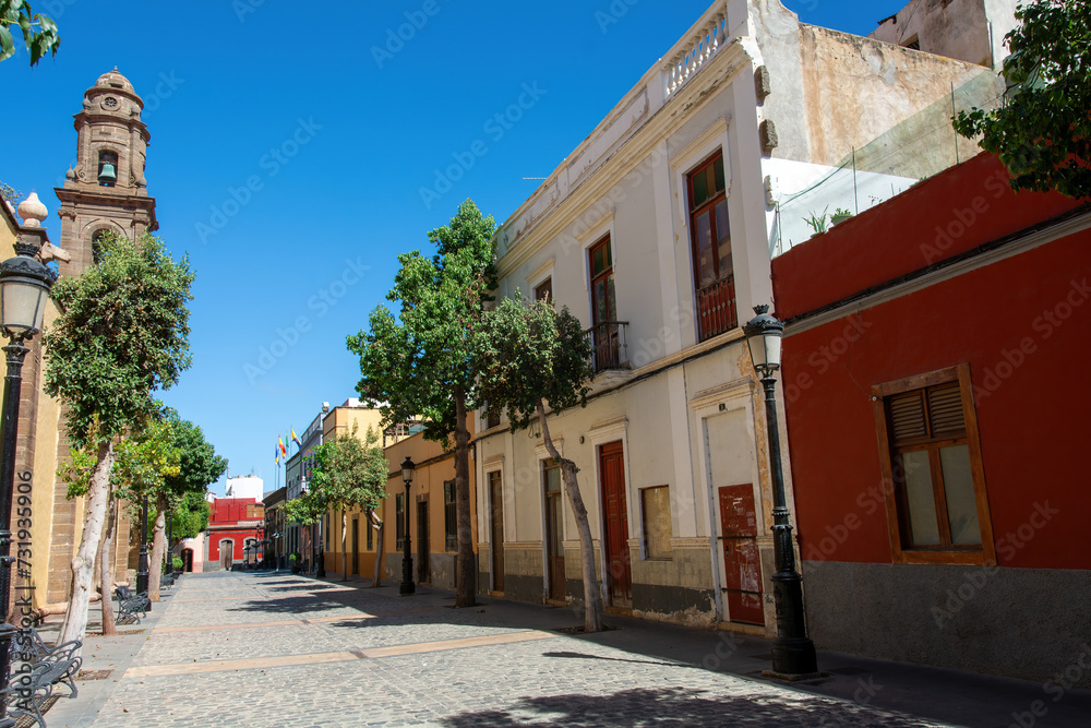 Street with the tower of a church in the old town of Galdar, a town on Gran Canaria in Spain