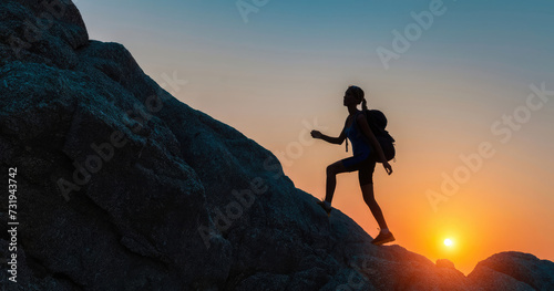 A young girl climbs a mountain with a backpack against the background of the sunset. The silhouette of a female tourist against the background of sunlight. Climbing, walking, sports. Generative AI.