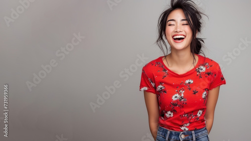 Asian woman wear red t-shirt smile laugh out loud isolated