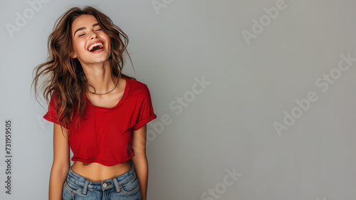 Brunette woman wear red t-shirt smile laugh out loud isolated