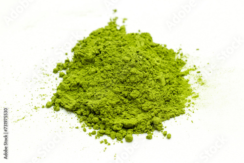 matcha green tea extract powder isolated white background