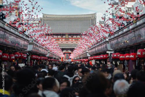Crowds along Nakamise Dori, the main street leading up to the main prayer hall at the historic Sensoji Temple in Asakusa, the oldest temple in Tokyo, Japan. (Translation of characters: Thunder Gate)