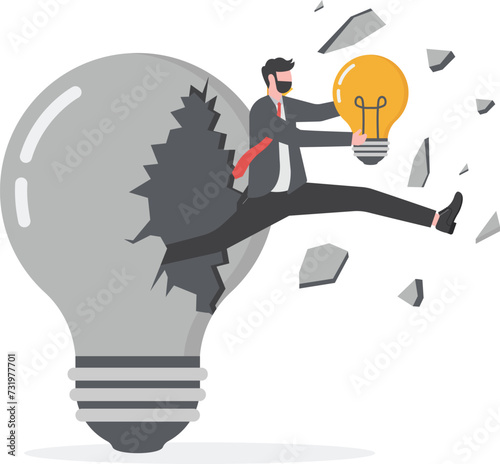 Overcoming obstacles. businessman holding a light bulb and jumping out of a broken light bulb

