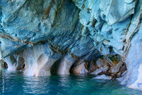 Sculpted blue chapels of Marble caves or Cuevas de Marmol at turquoise General Cerrerra Lake. Location Puerto Sanchez, Chile