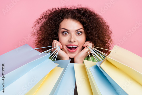 Fototapet Photo portrait of attractive young woman admire charming hold shopping bags dres