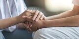 Empathy, trust and nurse holding hands with patient for help, consulting support and healthcare advice. Kindness, counseling and medical therapy in nursing home for hope, consultation and psychology