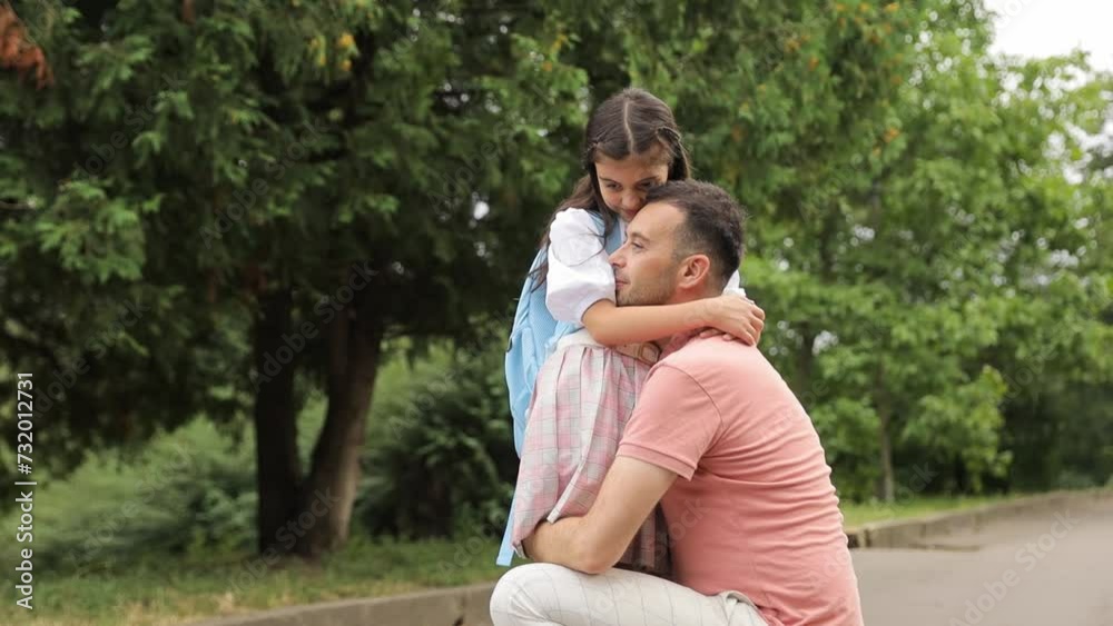 A man is carrying a little girl on his shoulders A man is carrying a little girl on his shoulders