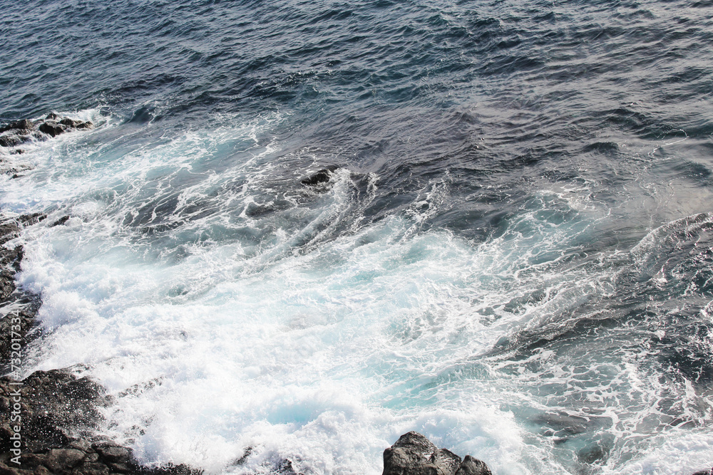  blue ocean waves on the rocks