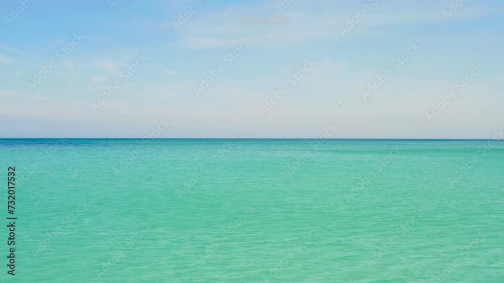 Low flight, pull inn shot over dreamy turquoise water, pastel sky, peaceful oceans edge by the Nordic Coast of Scandinavia Low flight, pull inn shot over dreamy turquoise water, pastel sky, peaceful oceans edge by the Nordic Coast of Scandinavia