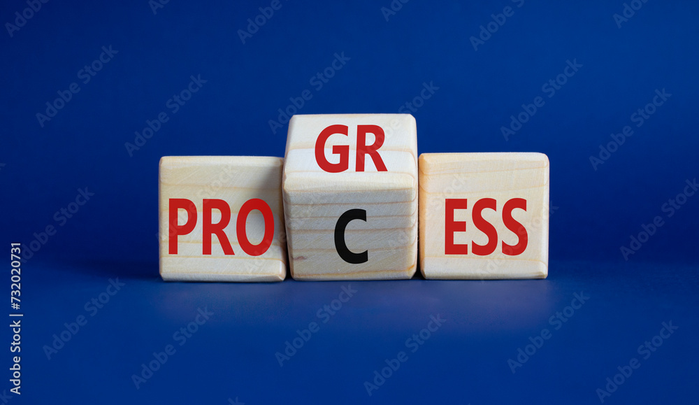 Process and Progress symbol. Wooden cubes with words Process and Progress. Beautiful deep blue background. Business and Process and Progress concept. Copy space Process and Progress symbol. Wooden cubes with words Process and Progress. Beautiful deep blue background. Business and Process and Progress concept. Copy space