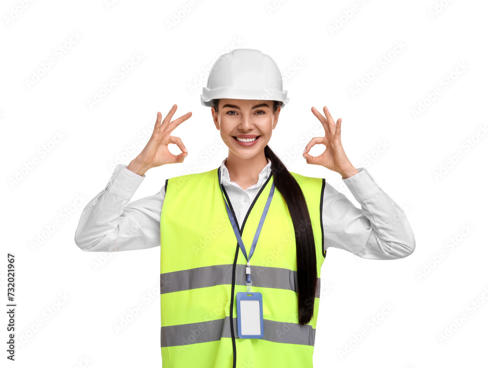 Engineer with hard hat and badge showing ok gesture on white background
