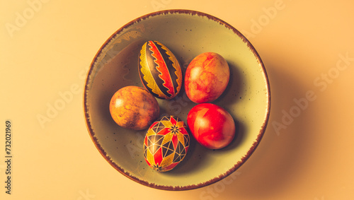 Easter eggs in a bowl on a light background with copy space