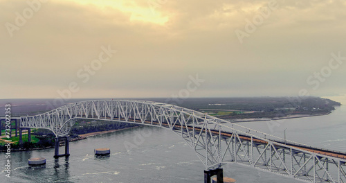 Aerial view of the Sabine Lake Causeway Bridge at Port Arthur Texas on an overcast day.
