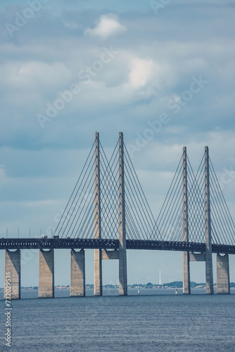 Capturing the essence of Scandinavian engineering, this image highlights the Oresund Bridge's cablestayed section between Copenhagen, Denmark, and Malmo, Sweden, on a serene day.