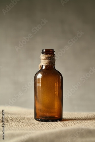 a small glass bottle on a beige background