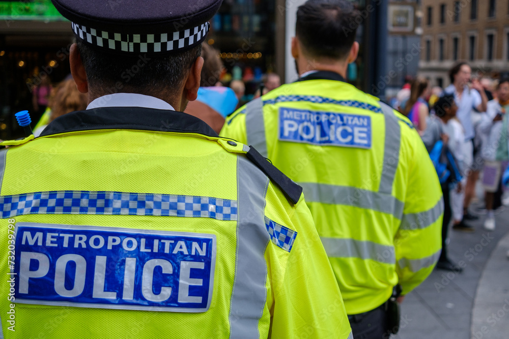 Police officers patrolling during event in London , metropolitan police - obrazy, fototapety, plakaty 
