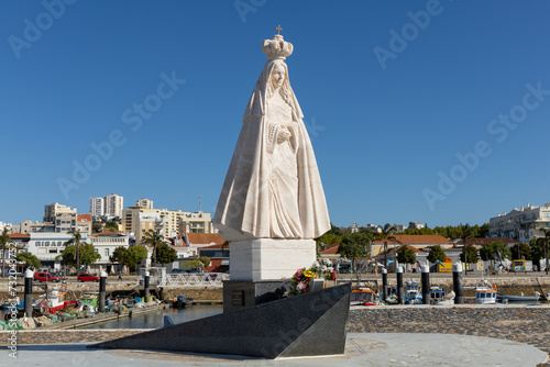 Setubal, Portugal. 14 August 2023. Statue “Nossa Senhora do Rosário de Tróia” at the Port in Setúbal who protects the fishermen who risk their lives every day to bring fresh fish to its inhabitants. photo