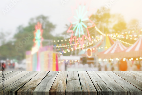 Empty Wooden Table on Blurred Background of Weekend Market Festival with Colorful Light Decoration for Product Display Montage