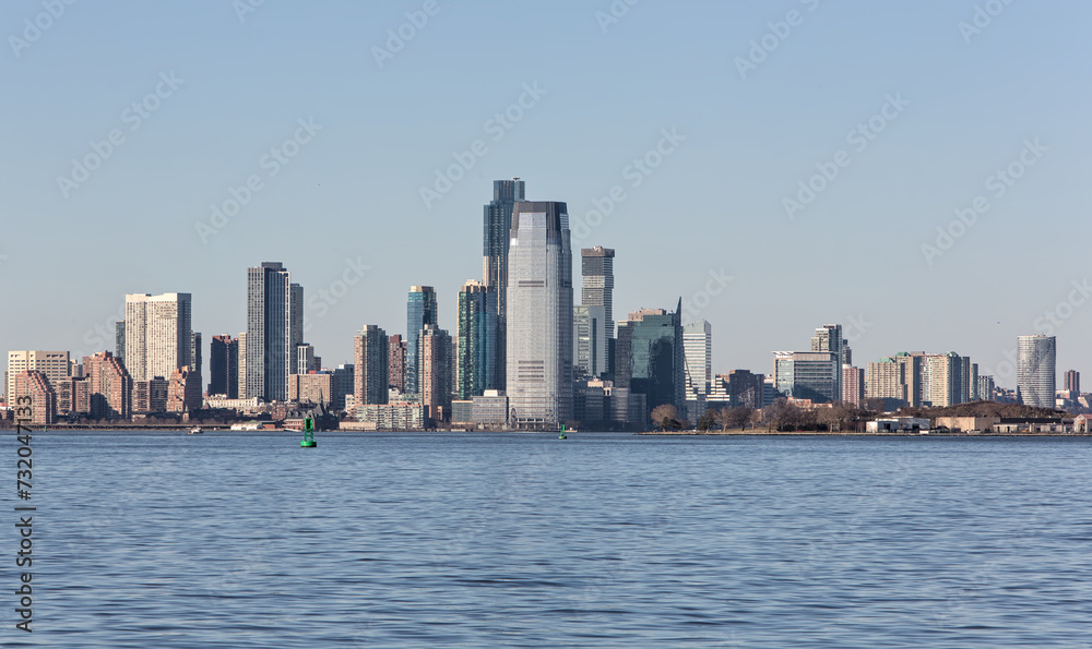 downtown jersey city nj view (tall buildings on the waterfront with hudson river in the foreground) new jersey