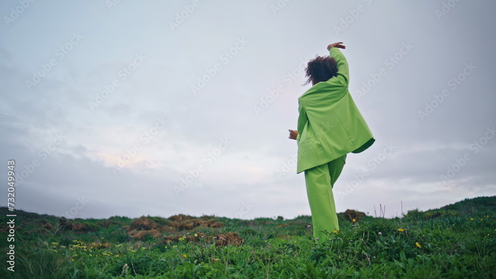 Graceful modern woman dancer performing contemporary choreography cloudy nature. Graceful modern woman dancer performing contemporary choreography cloudy nature.