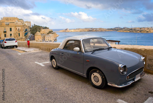 Vintage grey car in old harbor of downtown in Valletta, Malta