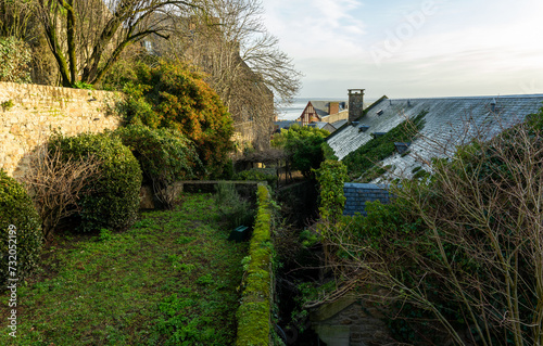 Overgrown houses and garden at Mont Saint Michel