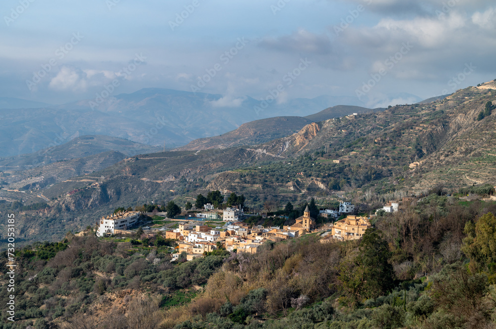 Top view of Carataunas, a town in the Alpujarra of Granada, between mountains