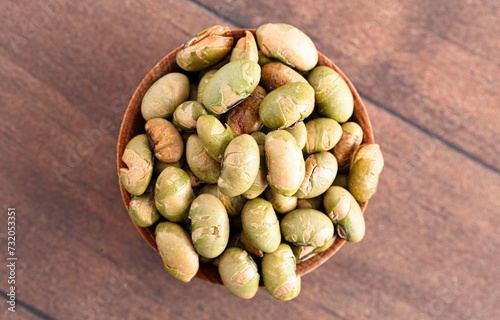 A Bowl of Dry Roasted Edamame Soybeans on a Wooden Table