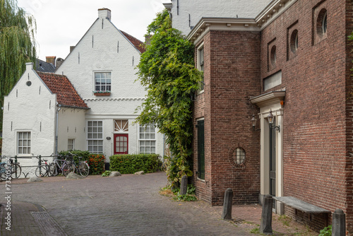 Narrow old street with wall houses in the old part of Amersfoort.