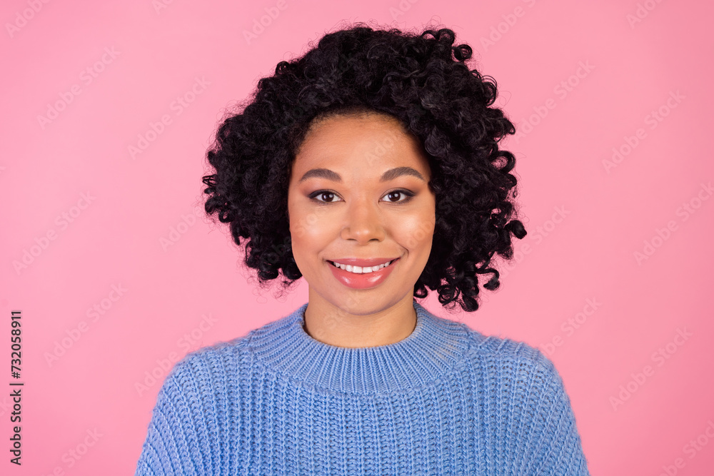 Photo portrait of pretty young girl toothy cheerful smile wear trendy blue knitwear outfit isolated on pink color background