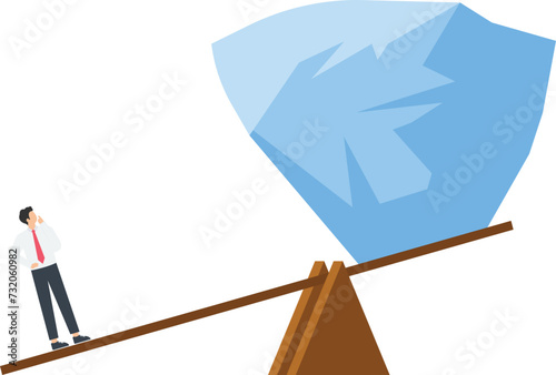 Businessman easily lifts huge stones with seesaw
