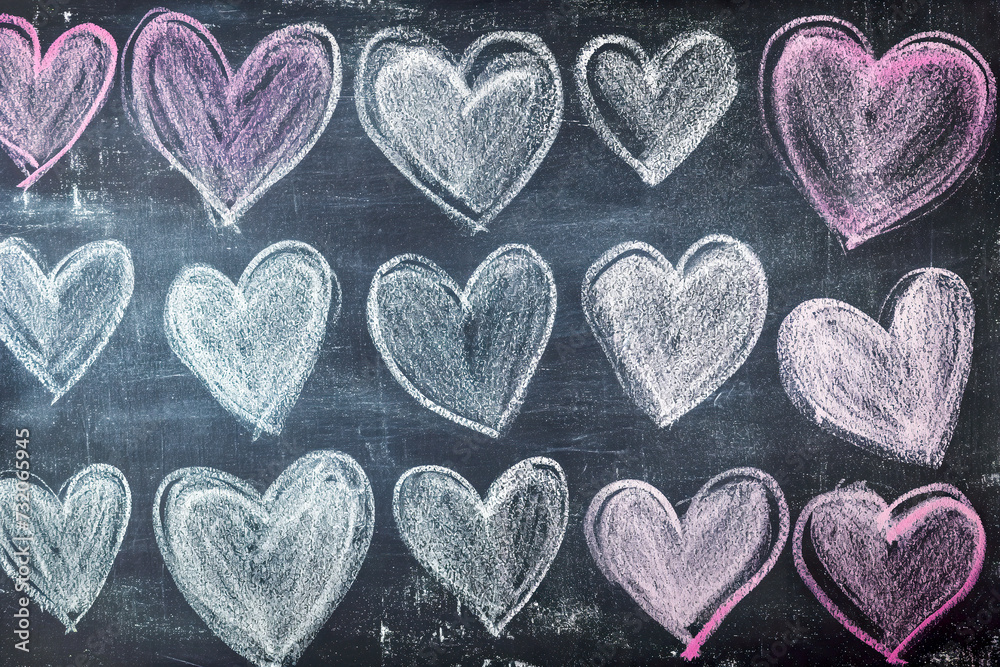 Obraz premium White and Pink Heart Shapes Chalk Drawings on Blackboard