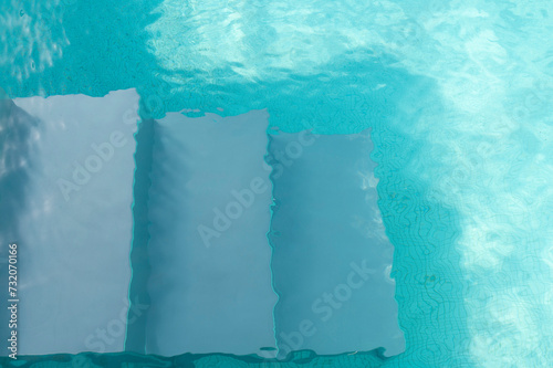 Steps in the swimming pool with a clear turquoise water