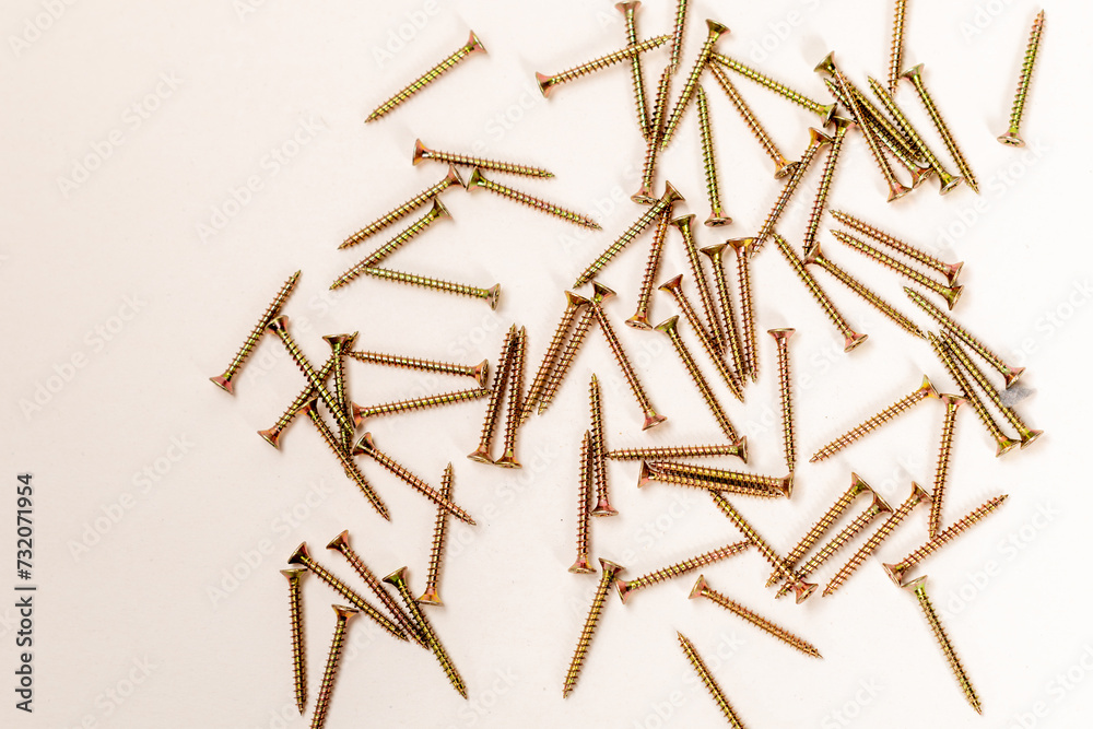 screws,catered screws on a white background, bolts, screws for mounting in wooden walls isolated on a white background screws,catered screws on a white background, bolts, screws for mounting in wooden walls isolated on a white background