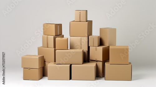 stack of brown cardboard paper boxes for packaging on neat white background