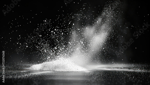 Dramatic splash with bright white particles on a dark background