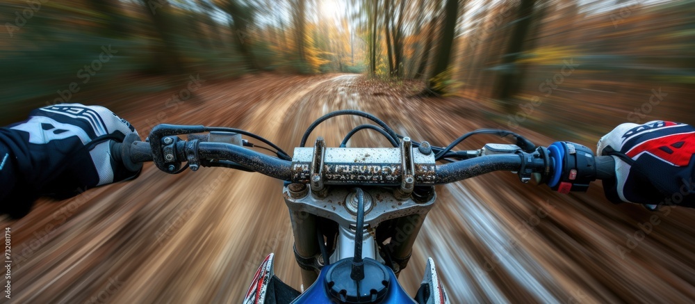 From rear rider view of a man riding a motorbike on a dusty road in a forest. AI generated image
