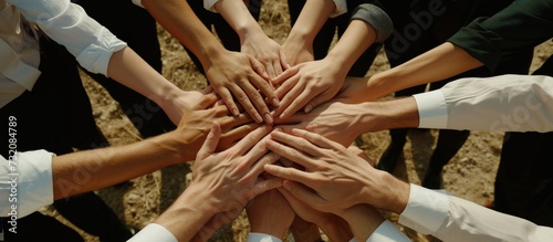 Close up of business partners stack of hands together at meeting to support each other. AI generated