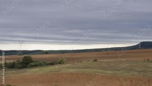 Dry crop field with stormy dark sky, climate change and global warming, greenhouse effect, cinematic 4K video