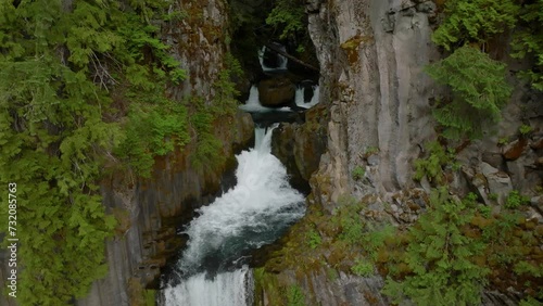 Huge waterfall in lush forest, Oregon.