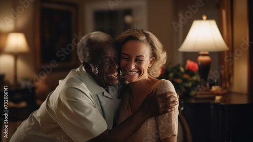 A healthcare professional providing home care embraces a senior patient with compassion. photo