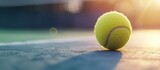 Close up a tennis ball with shadow on outdoor tennis court blur background. AI generated image
